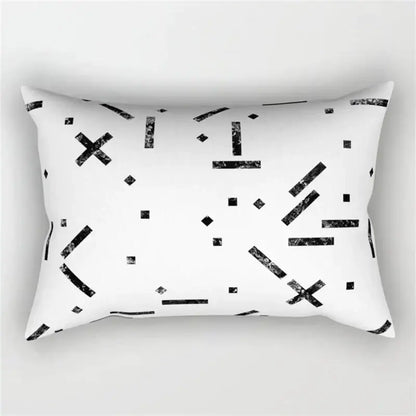 White rectangular pillow with black geometric wave line pattern featuring distressed lines crosses and dots for bedroom decor