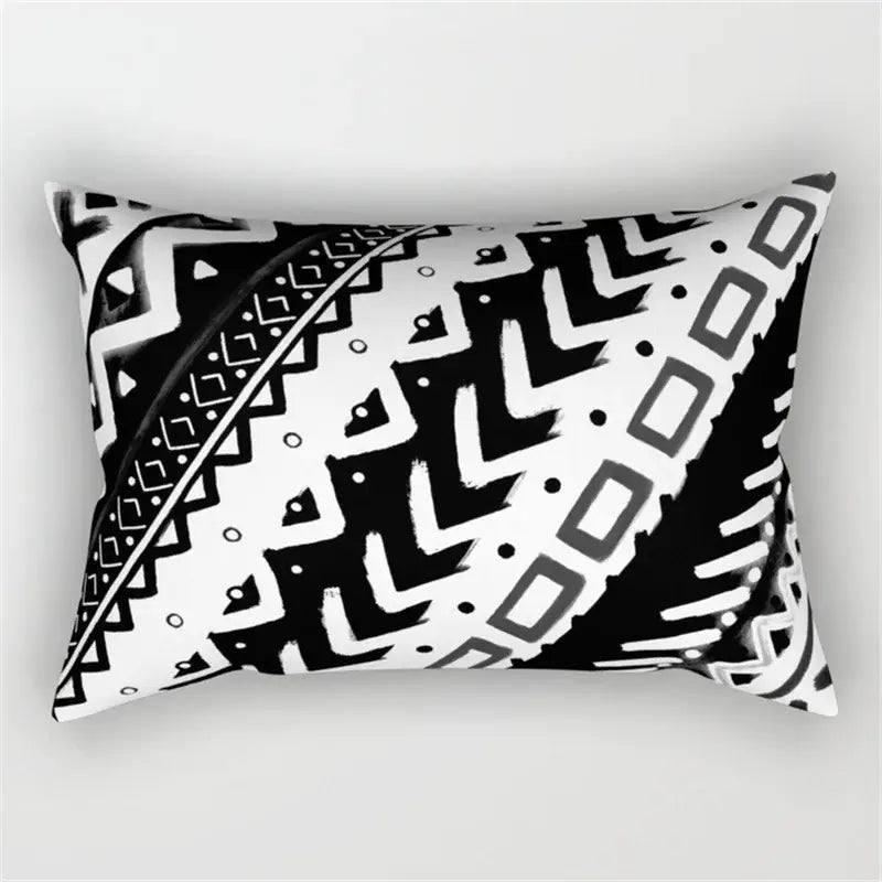 Rectangular black and white pillow with bold geometric wave line patterns for bedroom decor