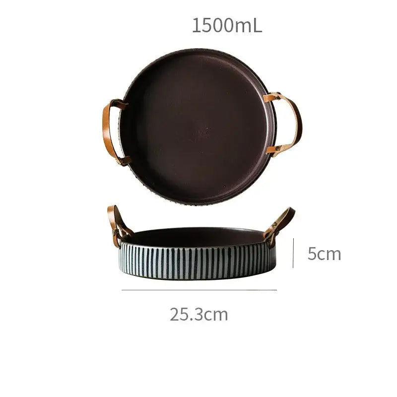 Dark brown ceramic porcelain bowl with gold-toned handles and striped rim featuring a leather handle by decorbites