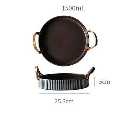 Dark brown ceramic porcelain bowl with gold-toned handles and striped rim featuring a leather handle by decorbites