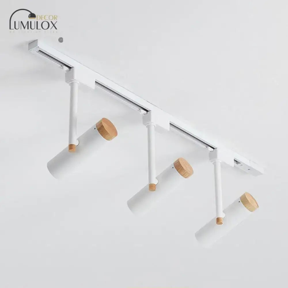 DecorBites™ Nordic tubular metallic spotlight featuring white track lighting with wooden caps and adjustable spotlights