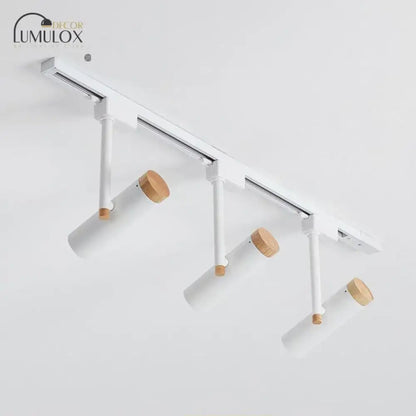 DecorBites™ Nordic tubular metallic spotlight featuring white track lighting with wooden caps and adjustable spotlights