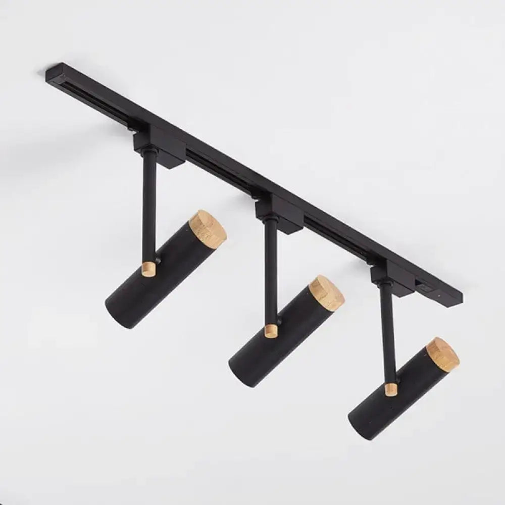 Black DecorBites Nordic tubular metallic spotlight with three cylindrical heads and natural wood caps for track lighting