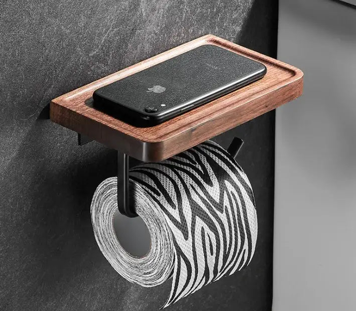 Wooden wall-mounted toilet paper holder with black metal bracket and zebra-patterned roll from decorbites bathroom hardware set
