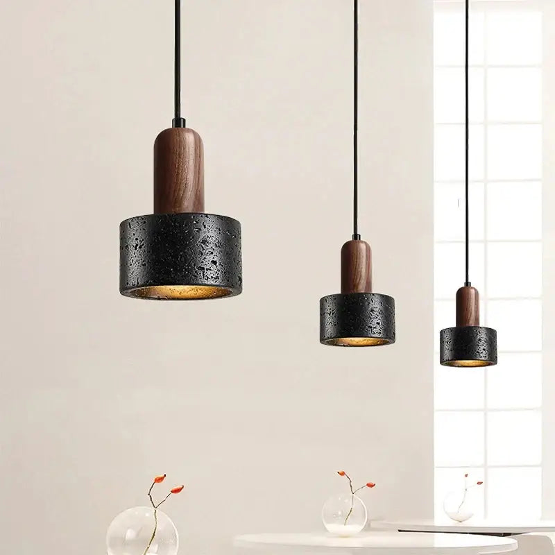Black and wood concrete pendant light with textured finish and dark wood accents for bedroom decorbites cream nordic decor