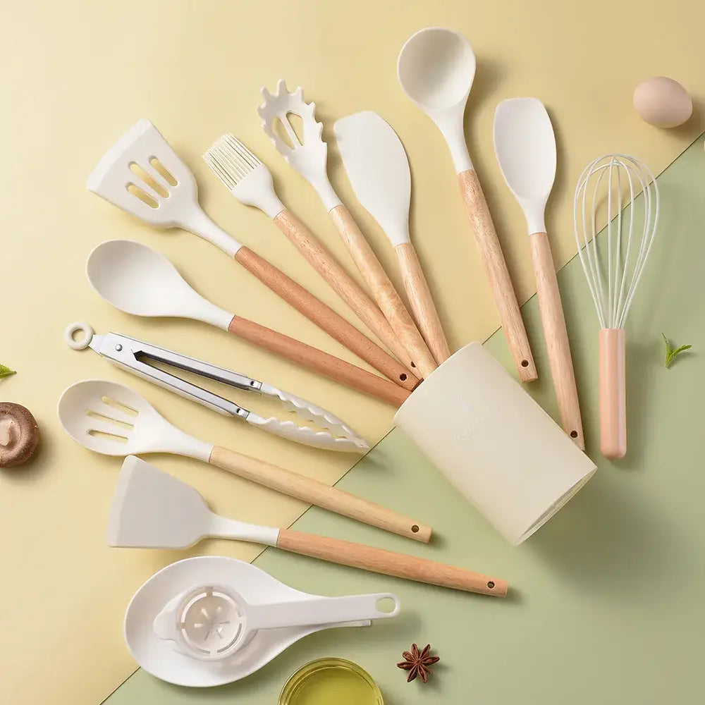 Set of white silicone kitchen utensils with light wood handles in black and wood silicone kitchen utensil set box