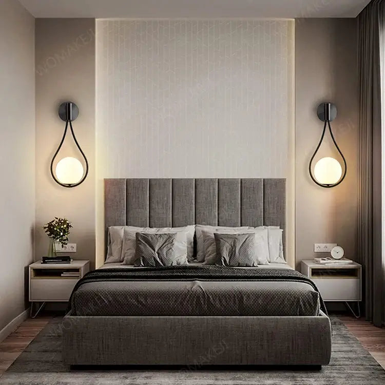 Gray upholstered bed shown alongside decorbites™ black battery operated wall sconces with remote and usb type-c charging