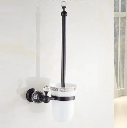 Black brass bathroom accessories set with black metal toilet brush holder and white ceramic cup with greek key pattern and crystal accents