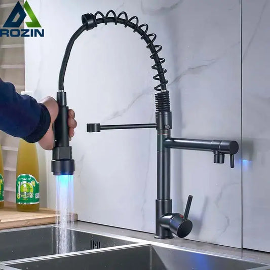 Black bronze dual spout kitchen faucet with matte finish, flexible coiled hose, and blue led lighting by decorbites