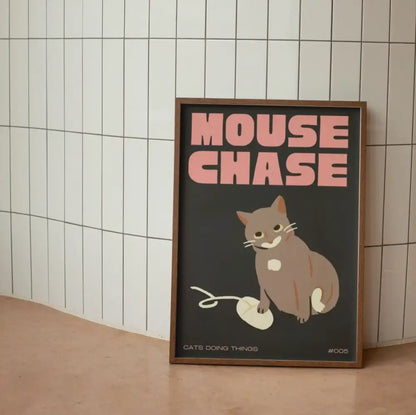 A framed wall art canvas featuring a gray and white cartoon cat and mouse yarn in black cat funny animal style