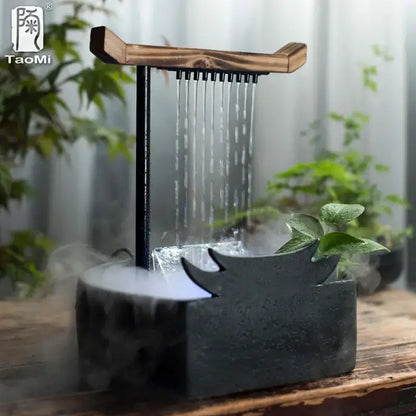 Black ceramic water fountain with wood roof and black metal spout emitting mist for living room decorbites ceramic water fountain