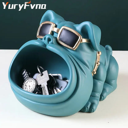 Teal ceramic cool dog sculpture with gold-rimmed sunglasses and collar serving as a key holder and coin bank decorbites