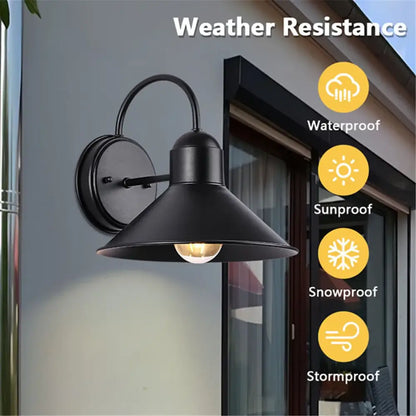 Black wrought iron outdoor wall sconce with wide bell-shaped shade and exposed bulb for decorbites black farmhouse barn lighting
