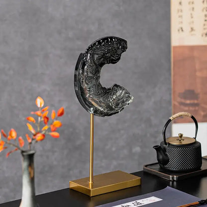 Black translucent gradient jade dragon and fish carving in elegant c-shape on gold stand for decorbites crescent moon decor