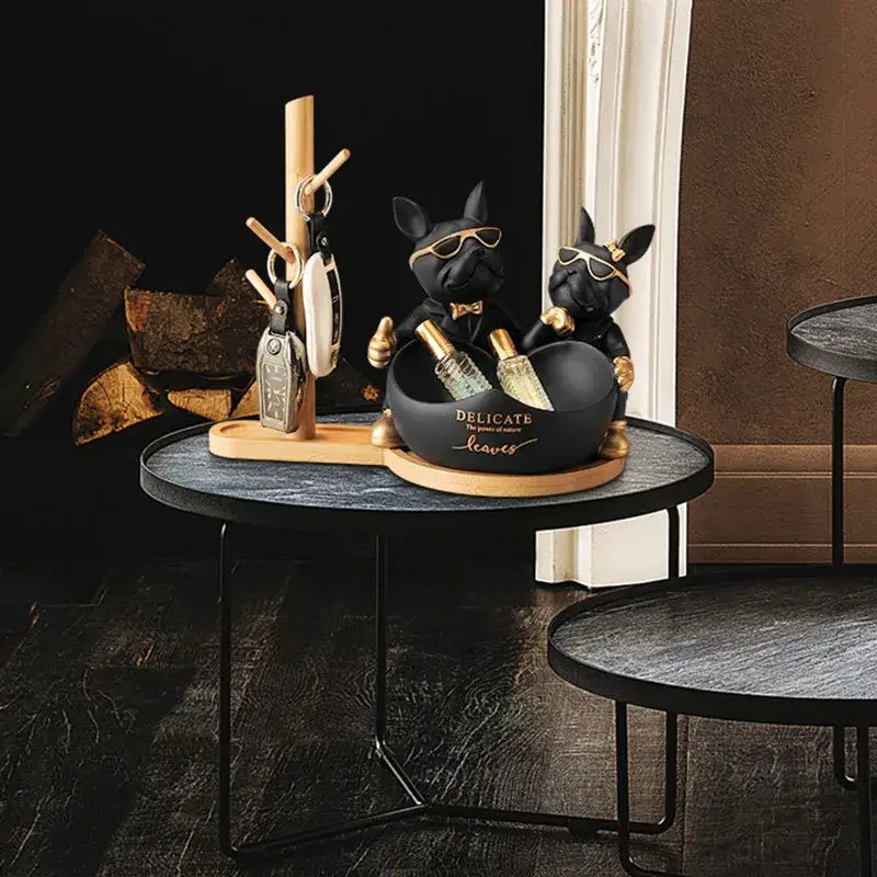 Black and gold french bulldog butler statue with sunglasses holding bottles in a matching bowl office desk organizer