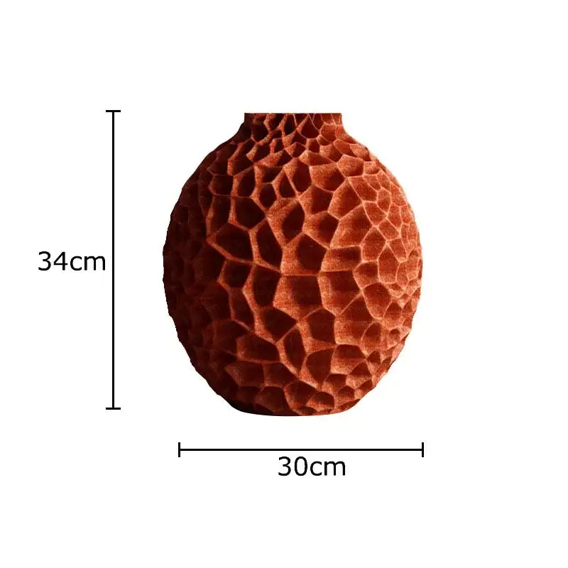 A terracotta ceramic vase with honeycomb texture ideal for artificial flower arrangement in living room decor