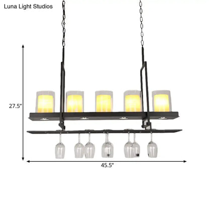 DecorBites™ black island light fixture with five warm candle-style lights and clear glass cylindrical pendant wine rack