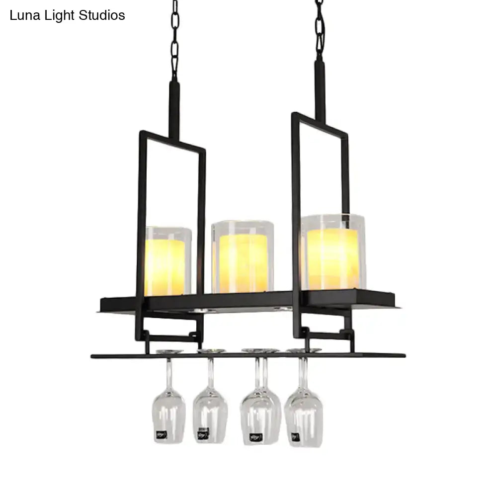 DecorBites black metal island light fixture with three glowing candle lights and clear glass cylindrical pendants