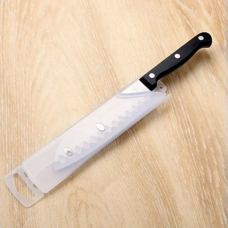 Black knife scabbard set with decorbites knife serrated blade black handle encased in clear plastic sheath