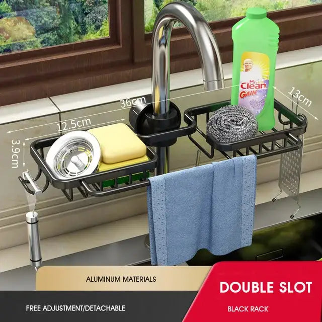 Black aluminum adjustable kitchen sink rack by decorbites with double slots, soap dish, hooks, and curved design holding sponge and towel