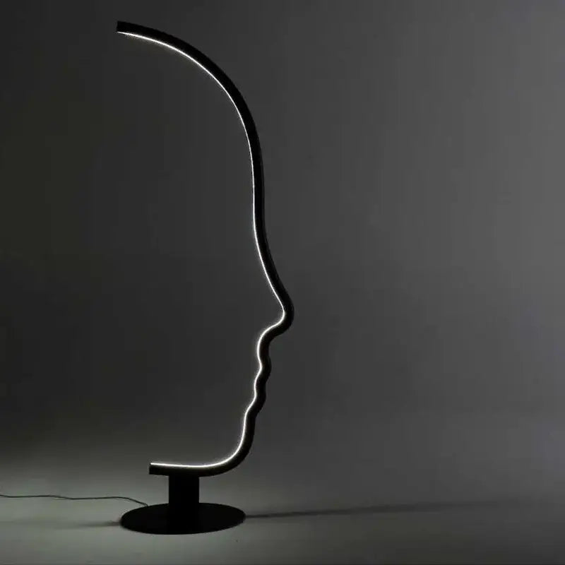 Black nordic human face floor lamp with illuminated outline shaped like a sleek black led decorbites floor lamp for living room