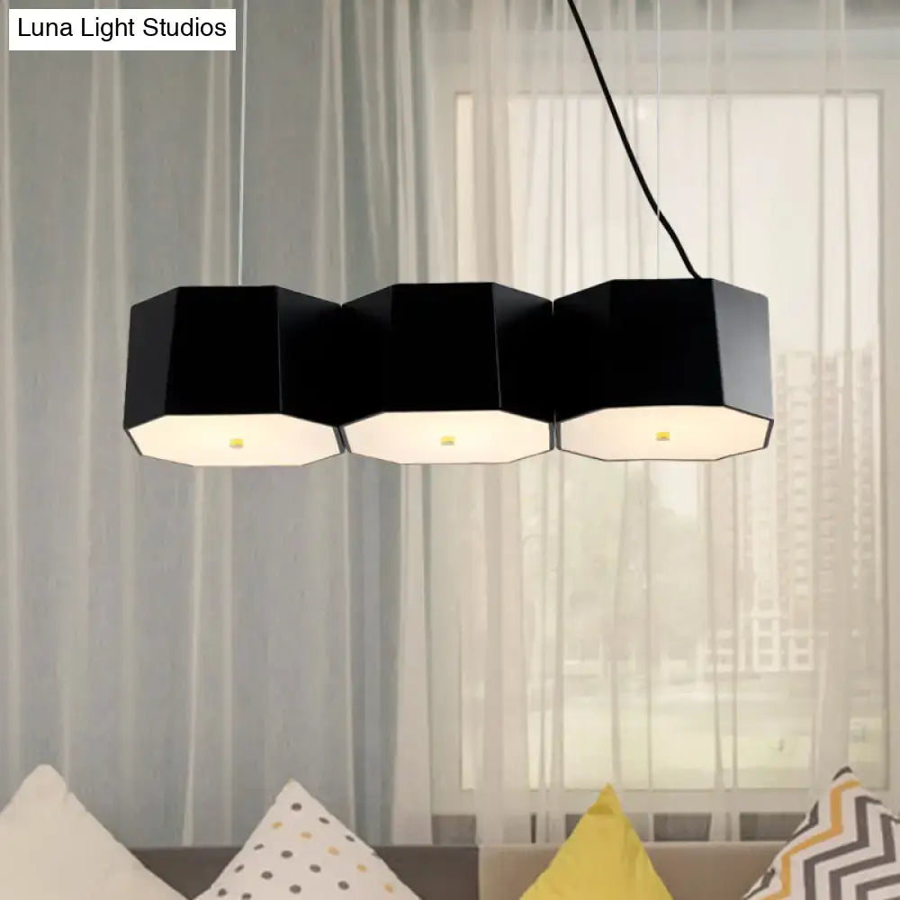 A black hexagonal pendant island light with white interior and octagon metal shade for dining room by decorbites