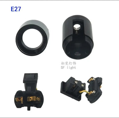Black plastic e27 socket lamp base with switch featuring a matte finish and gold-colored metal contacts for bedroom use