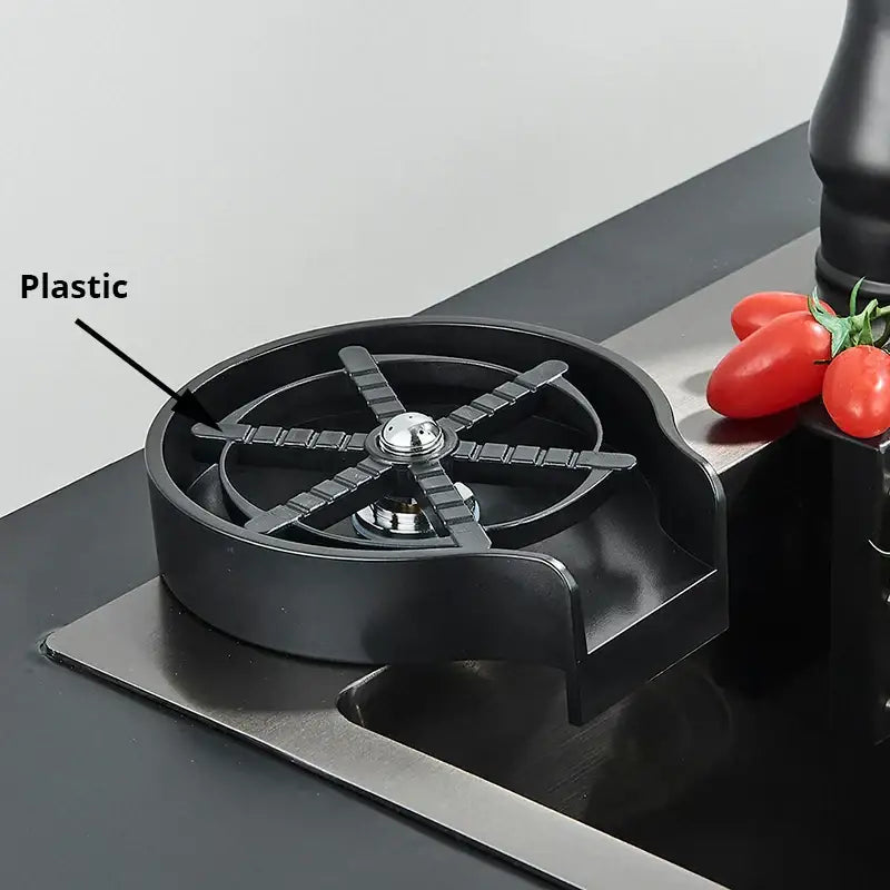 Black plastic bar spoon rest with central metallic knob and radial slots for glass rinser faucet kitchen sink accessory