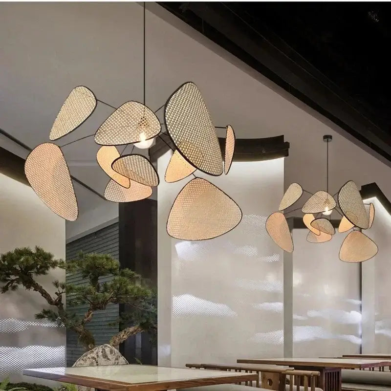 Modern decorbites black rattan ceiling chandelier with woven leaf-shaped shades in natural beige for dining room decor