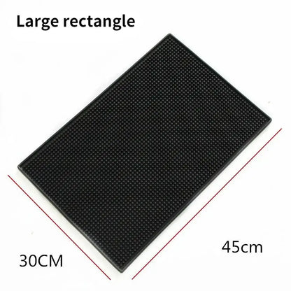 Black rubber coffee bar cup mat with raised dots and textured surface for kitchen use by decorbites coffee bar
