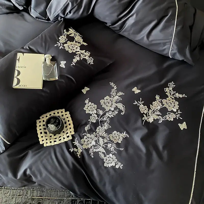 Black satin bedding set with intricate white cotton flowers embroidery and delicate butterfly motifs for bedroom use