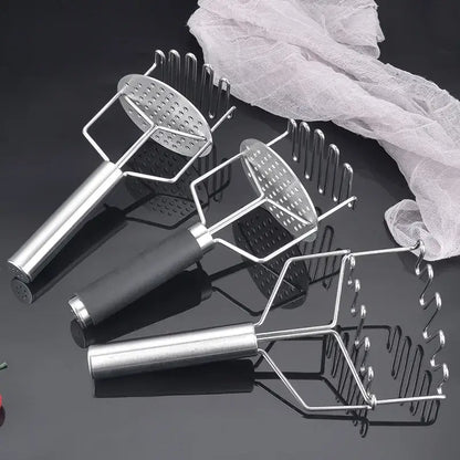 Three black and silver stainless steel potato mashers with perforated heads for varied kitchen food crushing textures