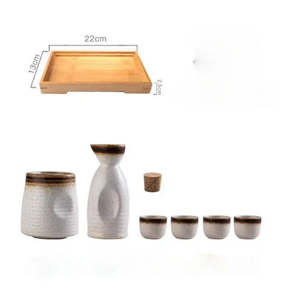 White ceramic wine sake set with brown glazed rims textured surfaces includes bottle cups glasses and cork stopper decorbites ceramic wine