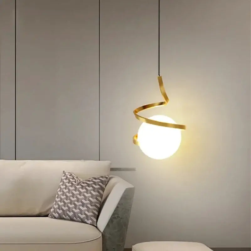 Modern black spiral cord pendant light with golden metal frame and frosted glass globe for dining room cord pendant installation