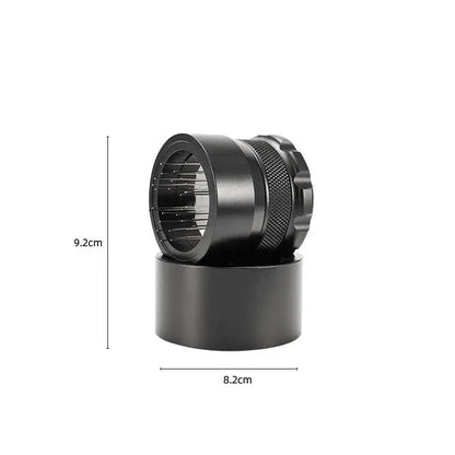 Black metal herb grinder with textured grip and internal chamber for decorbites coffee needle block distributor use