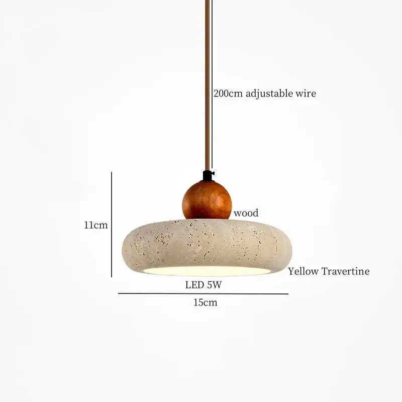 A modern decorbites black travertine led pendant light with a round yellow travertine shade and wood sphere for dining room decor