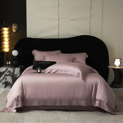 A soft lavender satin duvet set with elegant stitched edges made from lyocell eucalyptus fiber for luxury bedding use
