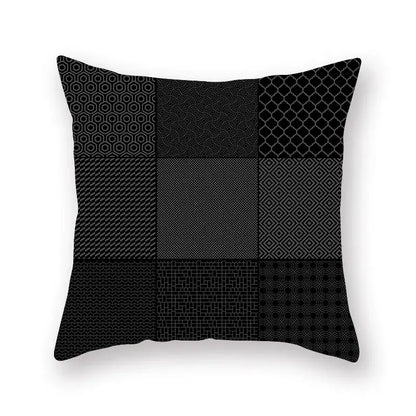 Black throw pillow with geometric star stripe patchwork design in gray shades for bedroom decor use