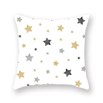 White throw pillow with geometric star stripe print in gold silver and black for bedroom decor