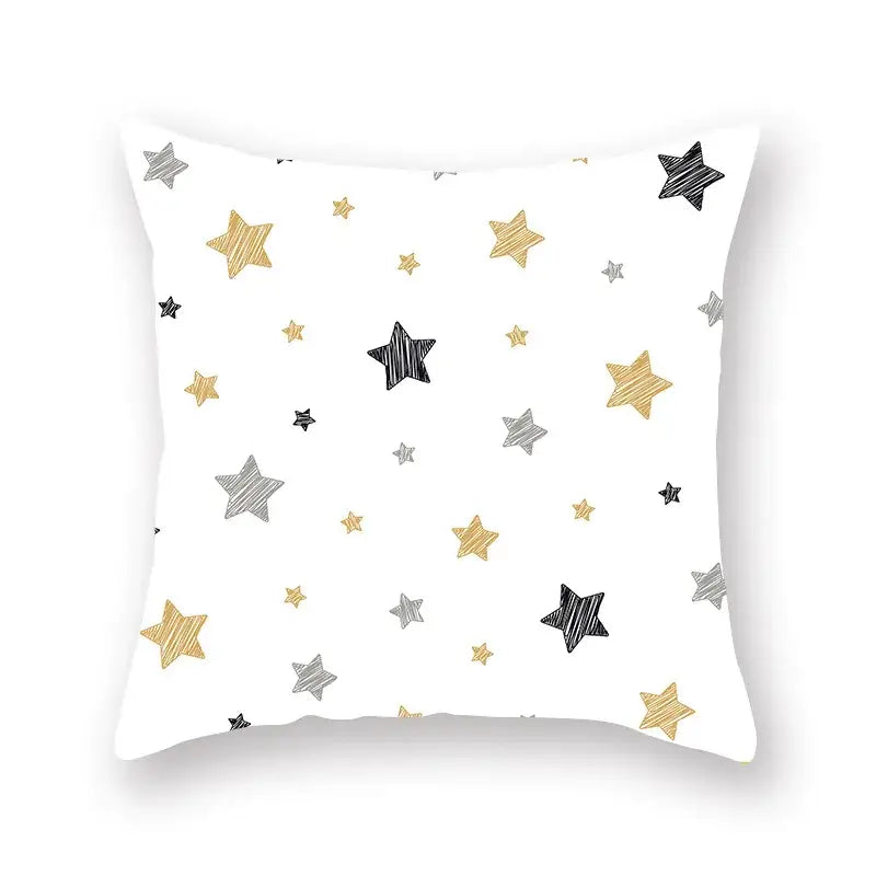 White throw pillow with geometric star stripe print in gold silver and black for bedroom decor