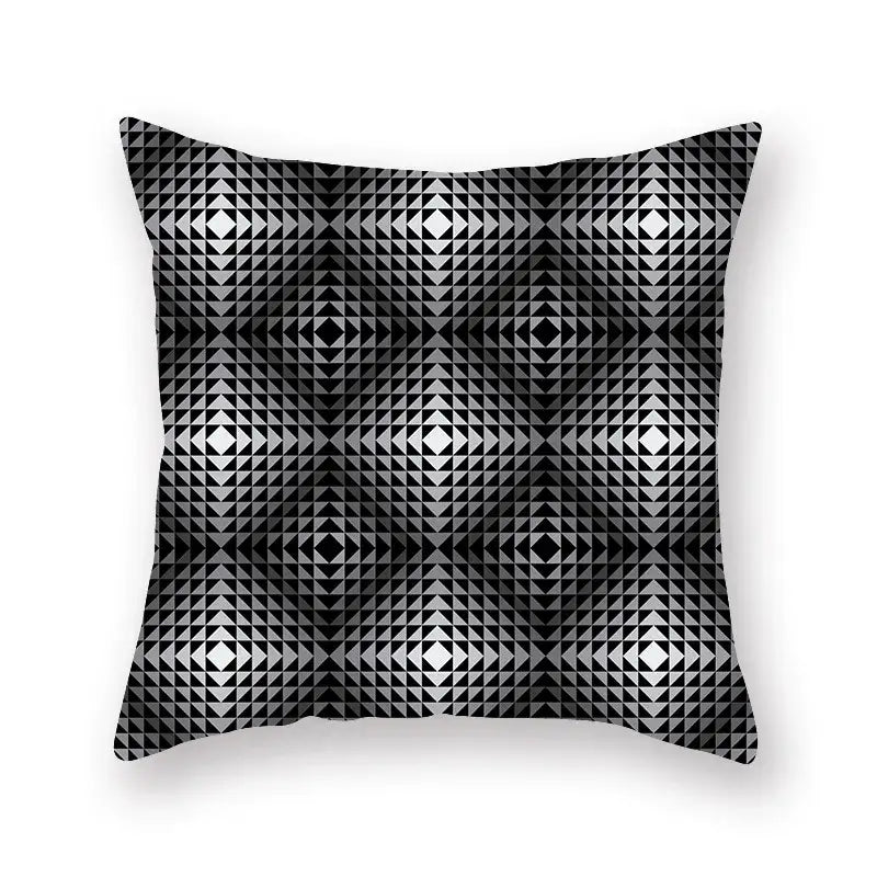 Square throw pillow with bold black and white geometric star stripe print featuring interlocking triangles forming diamonds