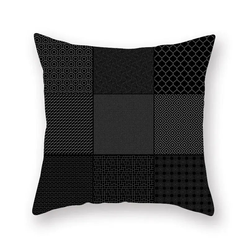 Black throw pillow with geometric star stripe patchwork design in gray shades for bedroom decor
