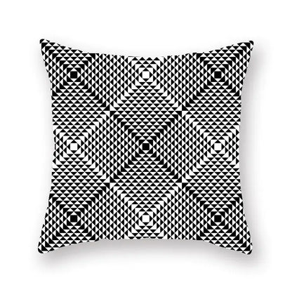 Square throw pillow with bold black and white geometric star stripe print featuring concentric squares for bedroom decor