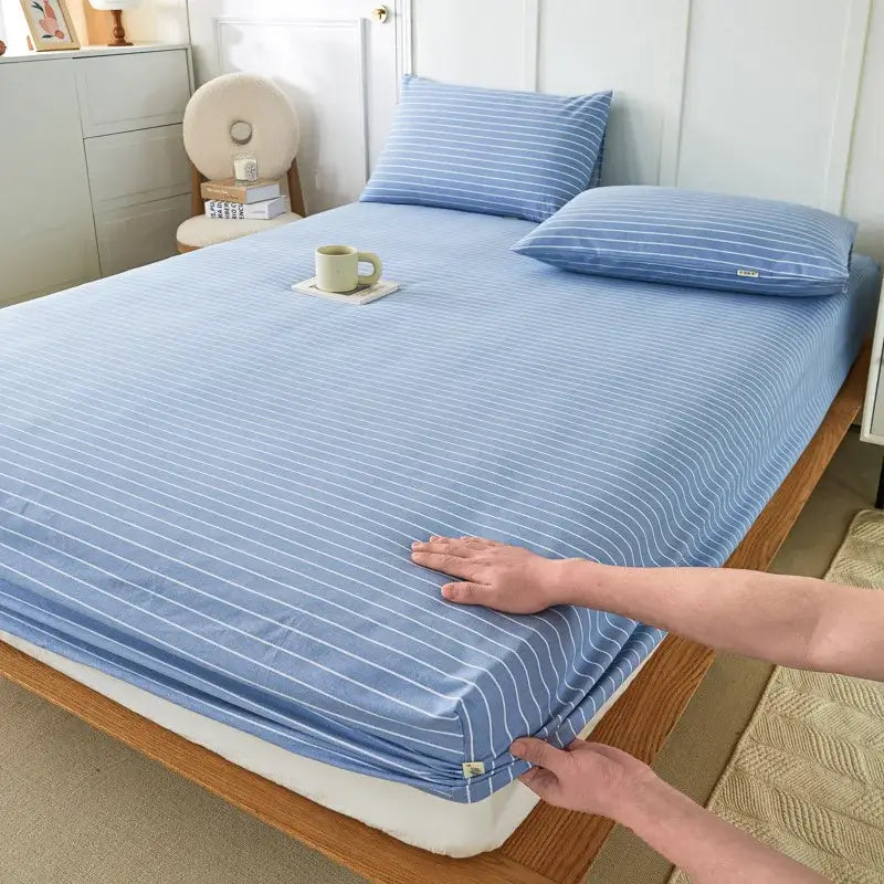 Light blue fitted sheet with thin white stripes made of soft decorbites coarse cotton queen fabric for bedroom use