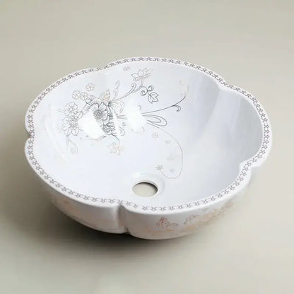 White ceramic hand painted ceramic vessel sink set with scalloped edge and silver gray floral vine patterns for bathroom