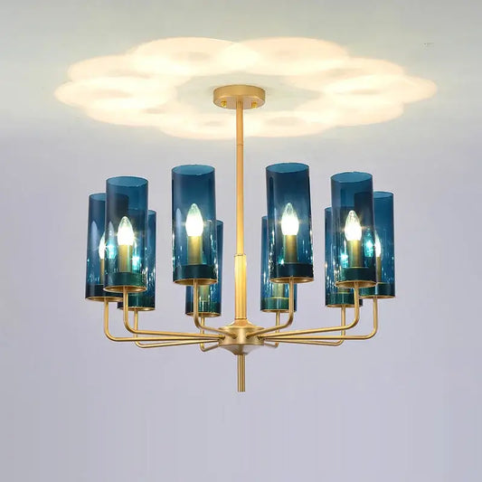 Blue and gold decorbites glass chandelier with blue glass cylinders and gold-toned metal for kitchen island lighting