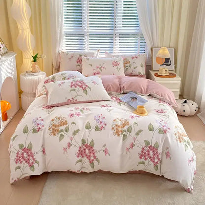 Floral-patterned decorbites cotton single duvet cover with soft pink and green blossoms on creamy white base with matching pillows