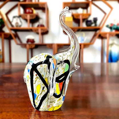 Translucent crystal glass elephant sculpture with vibrant blue green yellow and red abstract design for living room decor