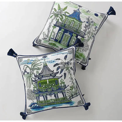 Square throw pillow case with embroidered blue and green chinese-style pavilions and navy tassels on white background