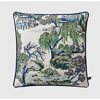 Square throw pillow case with traditional blue green and purple landscape design on off-white background with navy trim